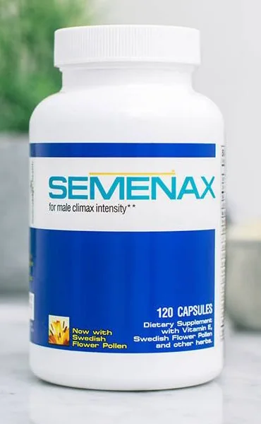 Semenax bottle standing on a marble counter, its label reading SEMENAX, 120 capsules, dietary supplement with vitamin E, Swedish flower pollen and other herbs